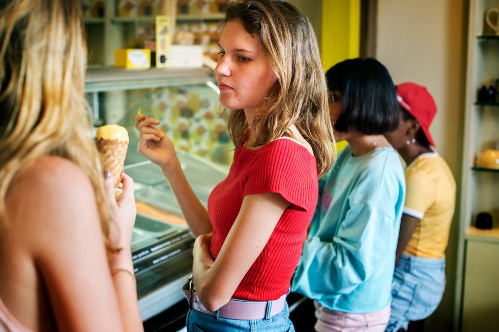 Group of diverse women eating ice cream together