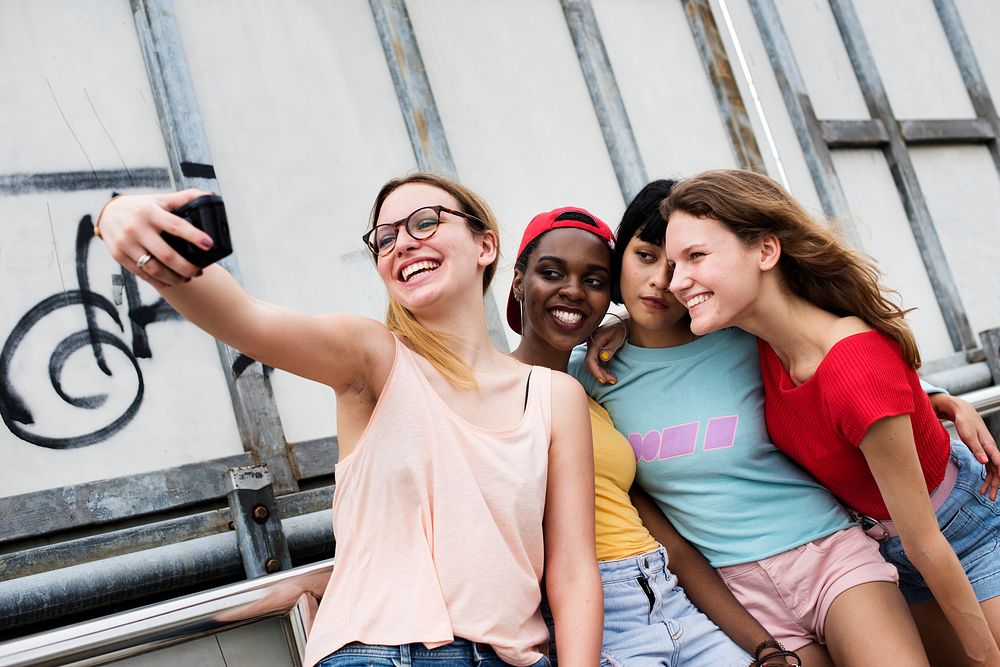 Group of diverse women taking selfie together