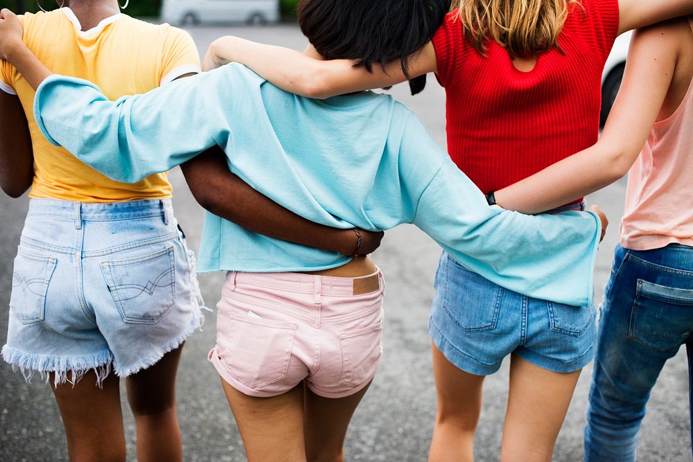 Rear view of a group of diverse woman friends walking together