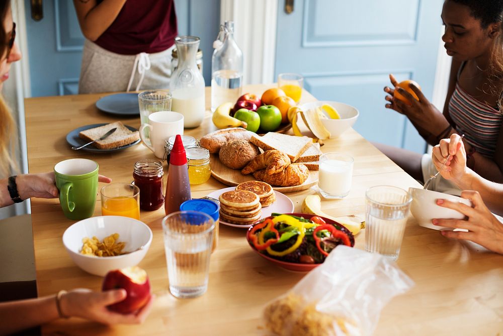 A group of diverse women having breakfast together