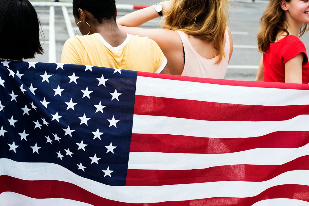 Rear view of group of diverse women group with American flag 