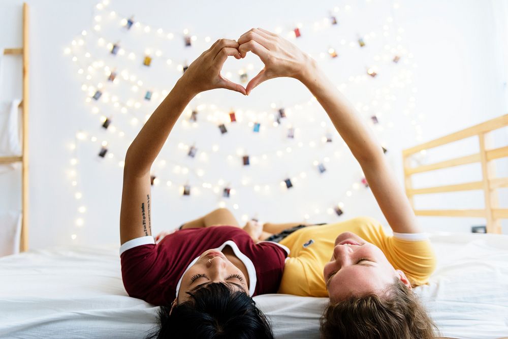 Women lying on the bed together