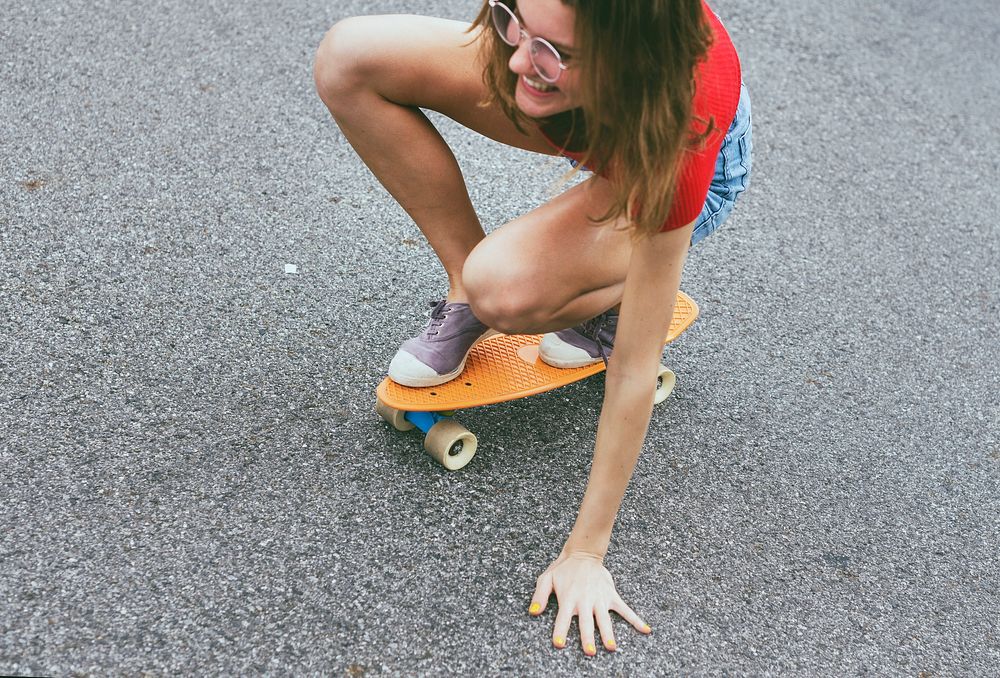 Closeup of a Caucasian woman skateboarding