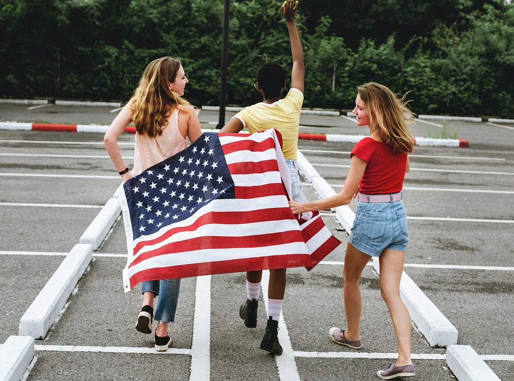 Rear view of diverse women group with American flag