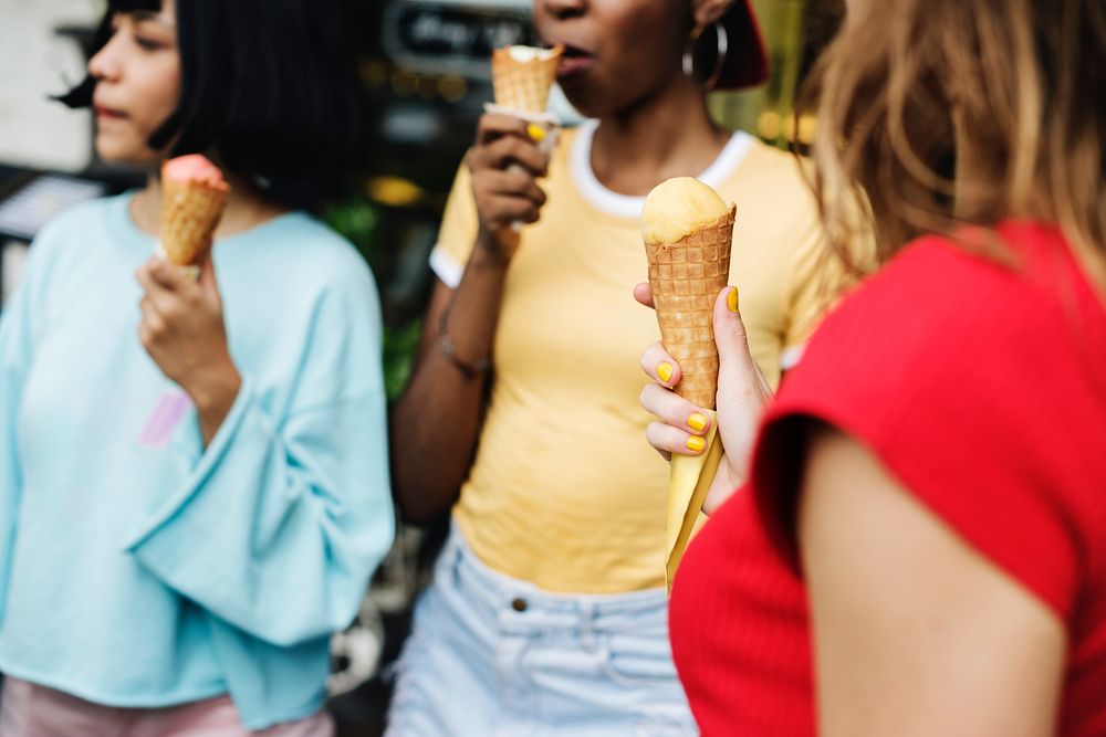 Group of diverse women eating ice cream together