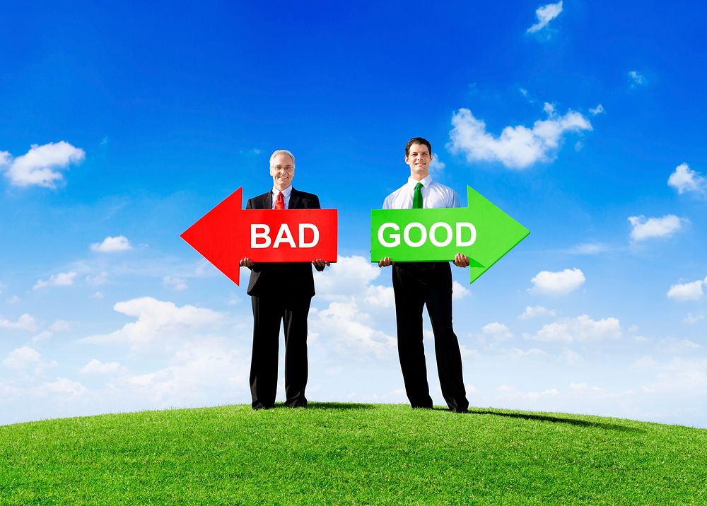 Two Businessmen Holding Contrasting Arrows for Bad and Good