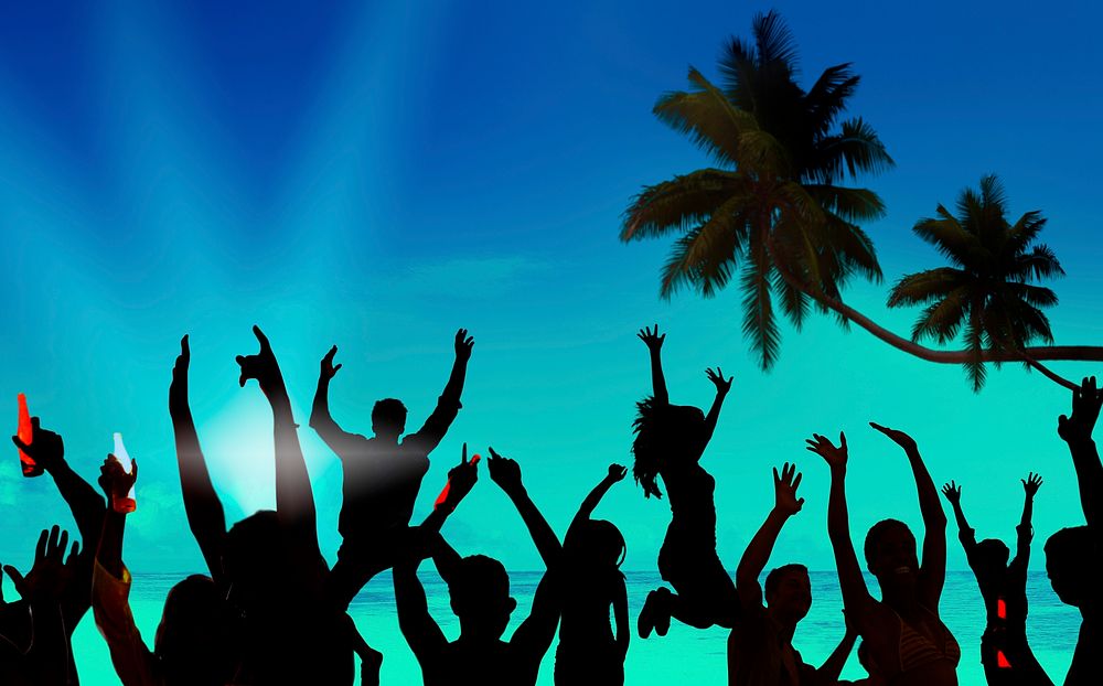 Silhouettes of Young People Celebrating on a Beach