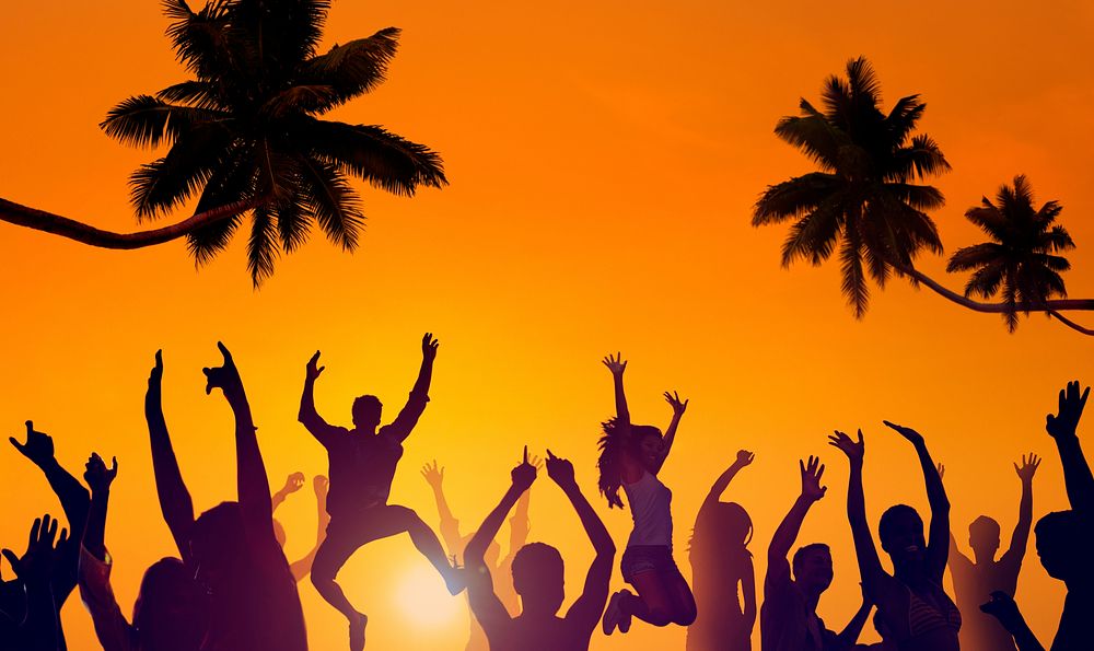 Silhouettes of Young People Partying on a Beach