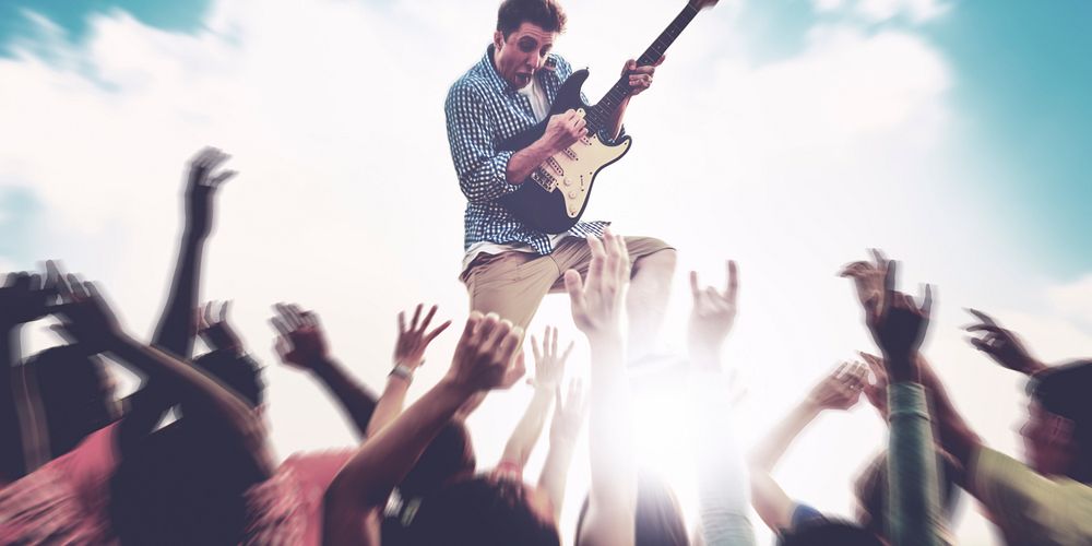 Young Man Guitar Performing Concert Ecstatic Crowds Concept