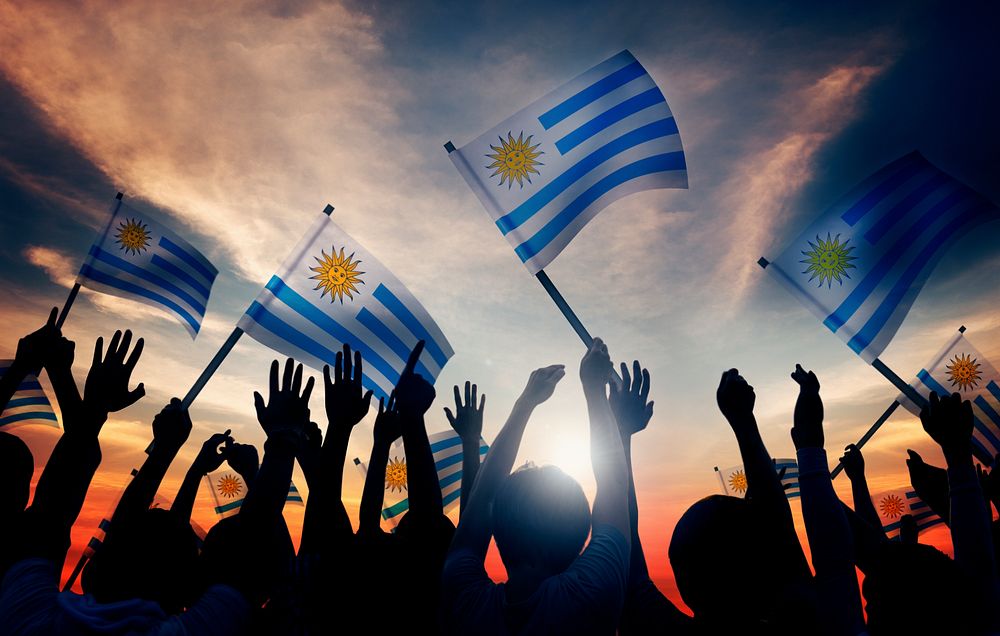 Silhouettes of People Holding Flag of Argentina