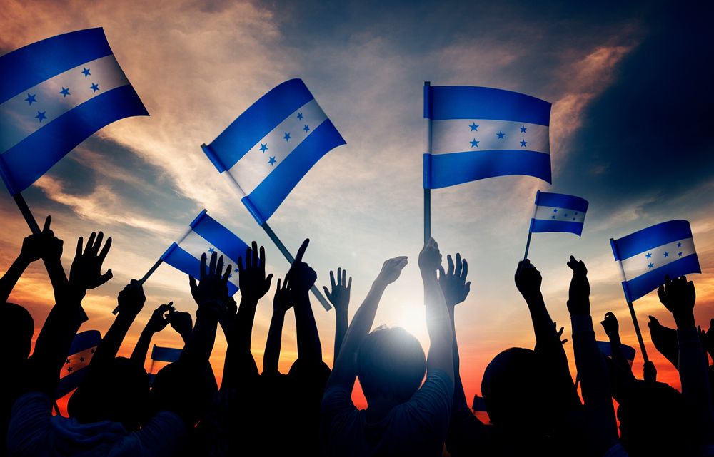 Silhouettes of People Holding Flag of Honduras