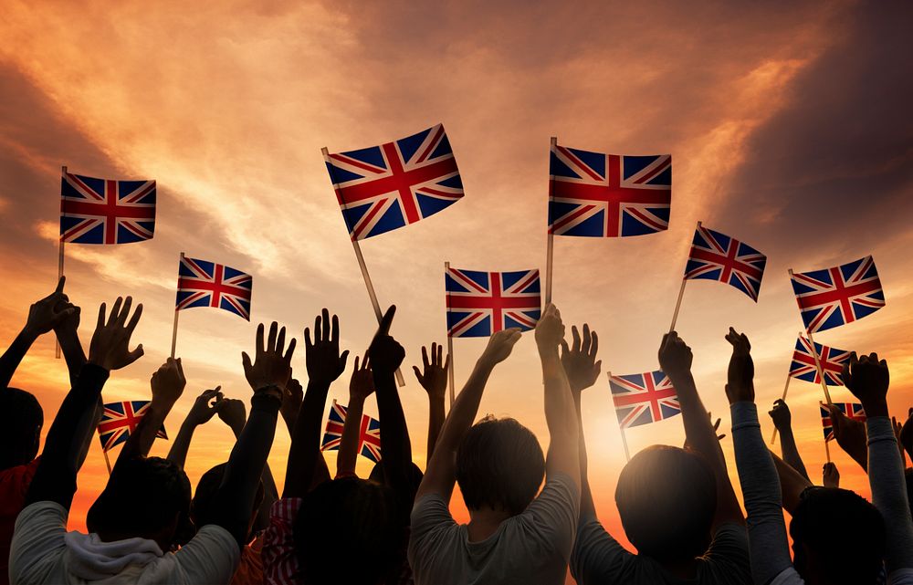Silhouettes of People Holding National Flag of UK