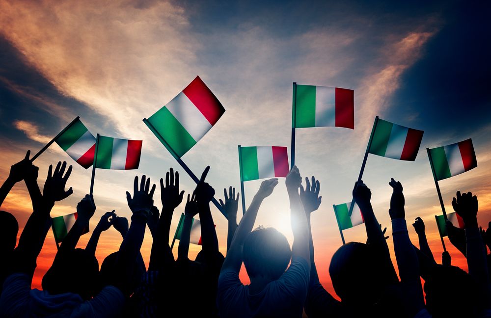 Group of People Waving Italian Flags in Back Lit