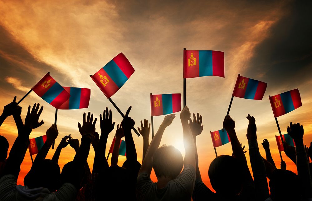 Group of People Waving Mongolian Flags in Back Lit