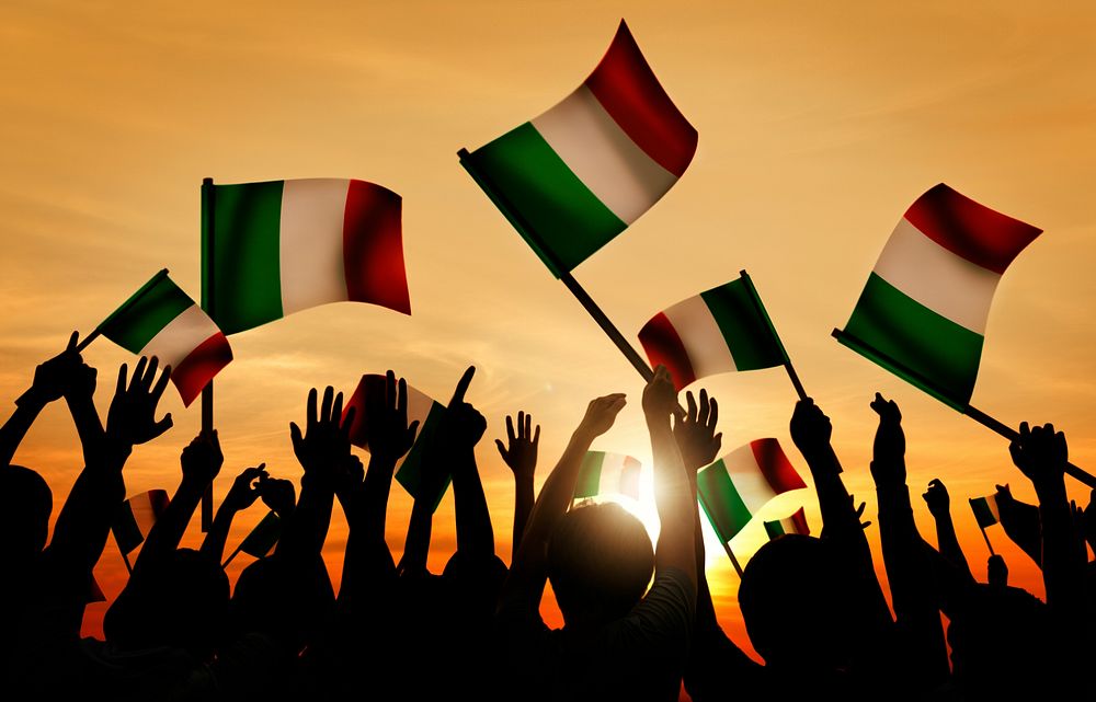 Silhouettes of People Holding Flag of Italy