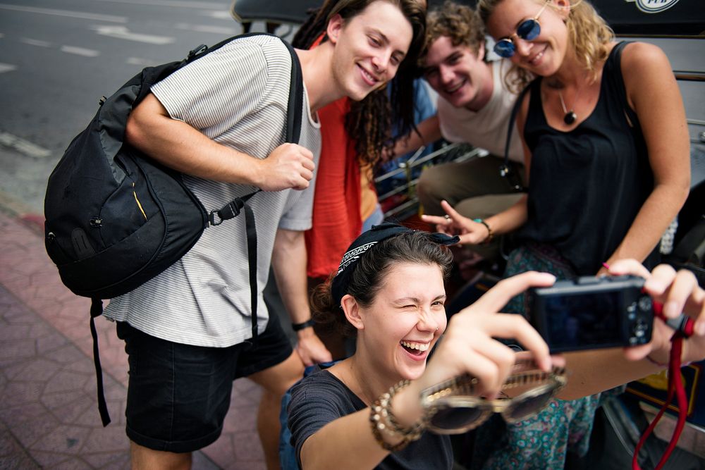 Group of tourists taking selfie together