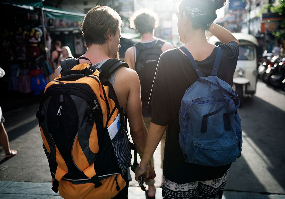 Closeup of a couple holding hands while walking