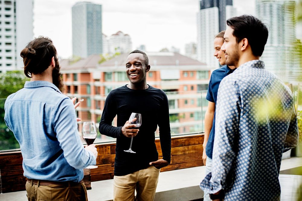 Group of male friends chilling on the rooftop