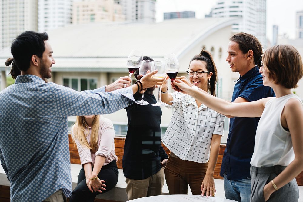 Group of friends on the rooftop having a toast