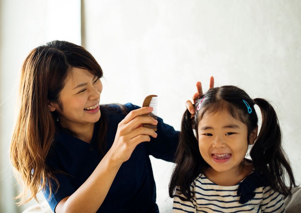 Cheerful japanese mother and daughter