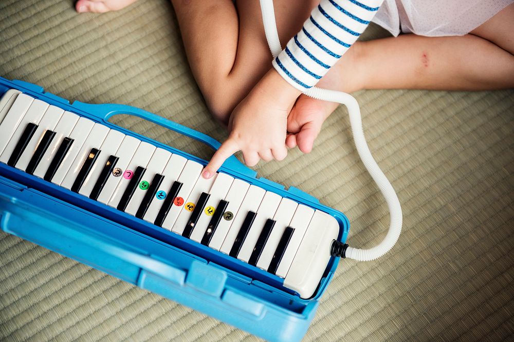 Girl palying piano music toy equipment