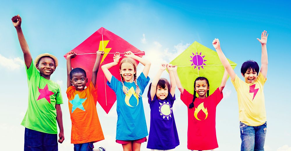 Group of Children Playing Kites Outdoors Concept