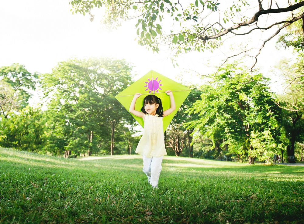 Little Girl Flying Kite Playing Cheerful Activity Concept
