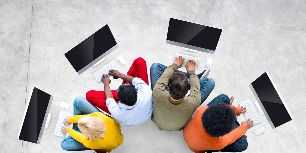 Group of diverse people using computer