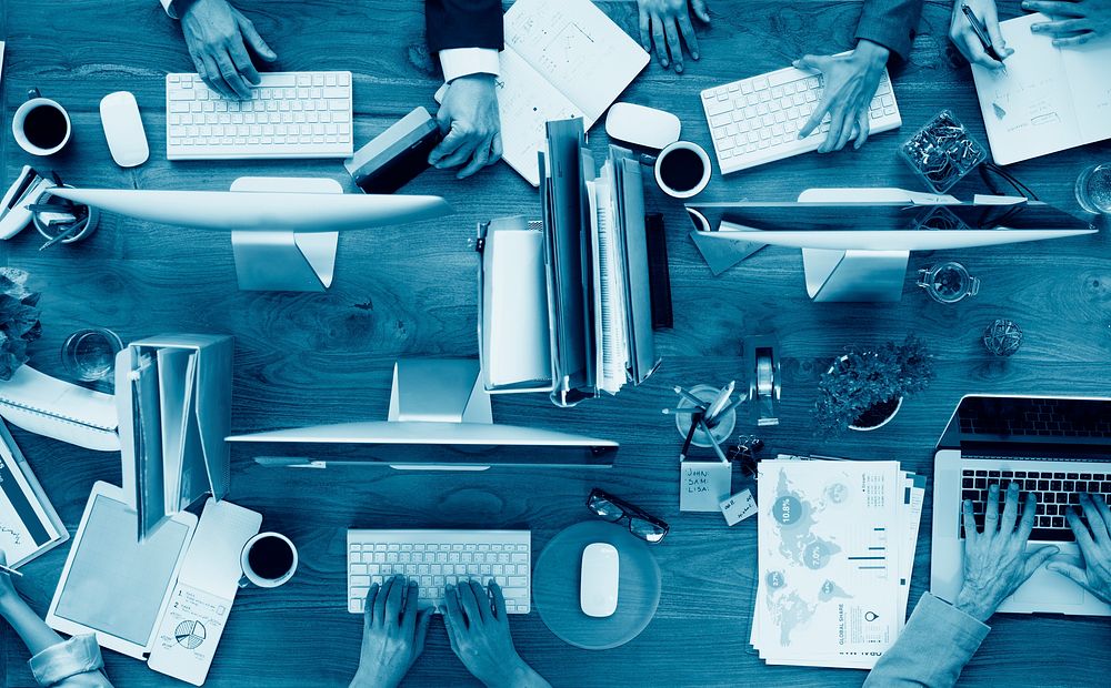 Group of Business People Working on an Office Desk Concept