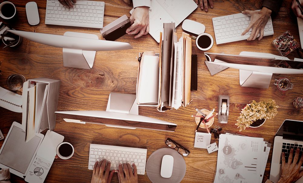 Group of Business People Working on an Office Desk Concept