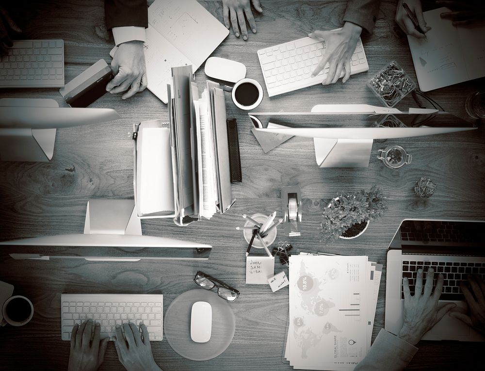 Group of Business People Working on an Office Desk Concept