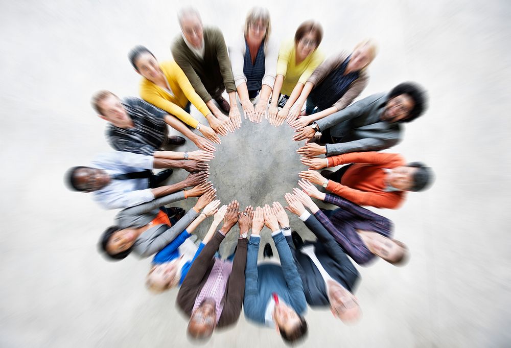 Aerial view of supported hands out together