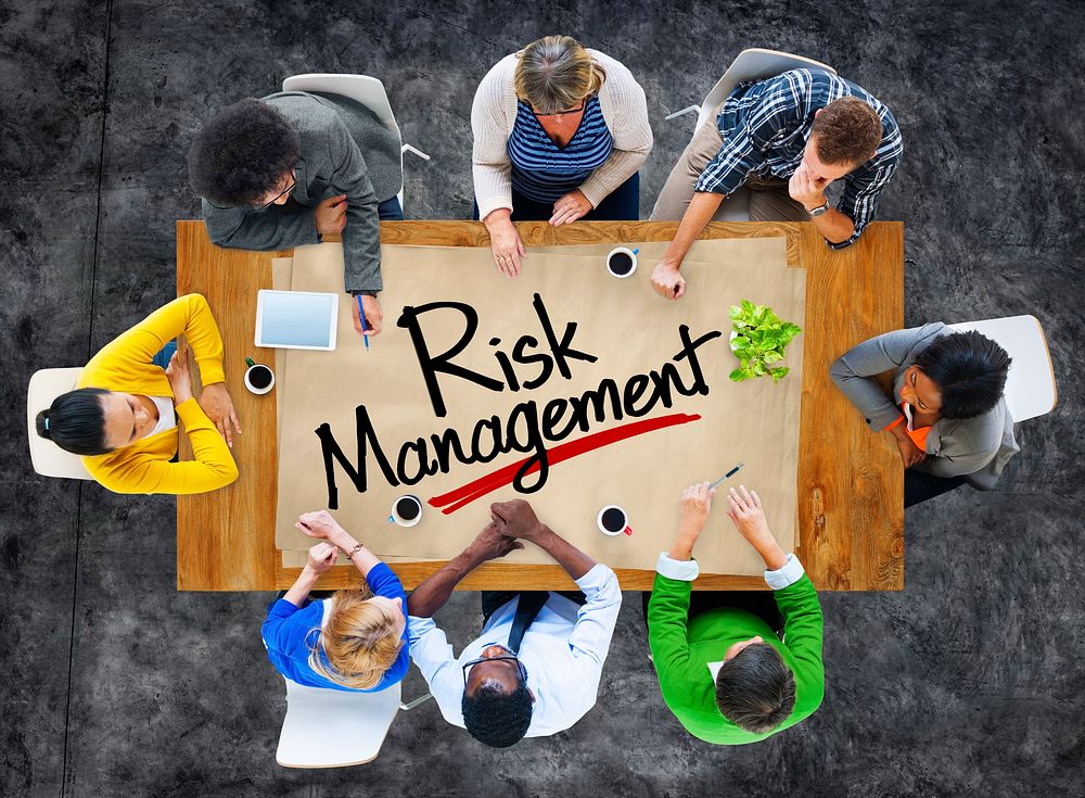 People in a Meeting and Risk Management Concepts