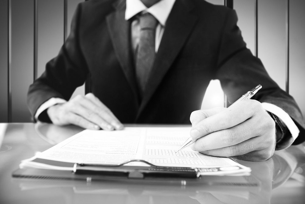 Businessman Signing Application Form Suit Concept