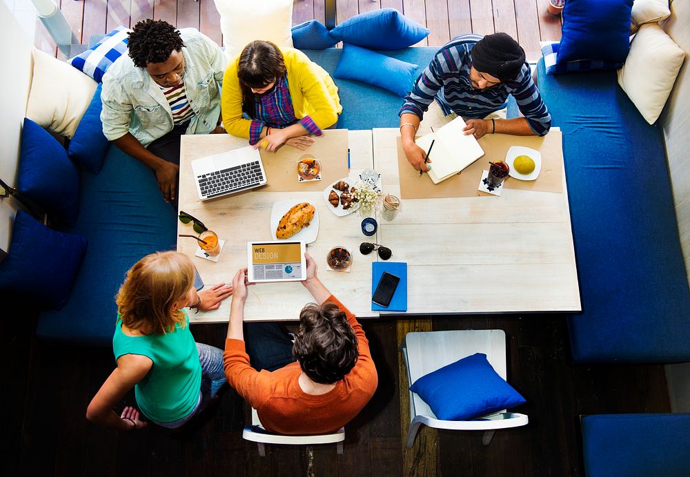 Group of diverse friends is brainstorming on their project