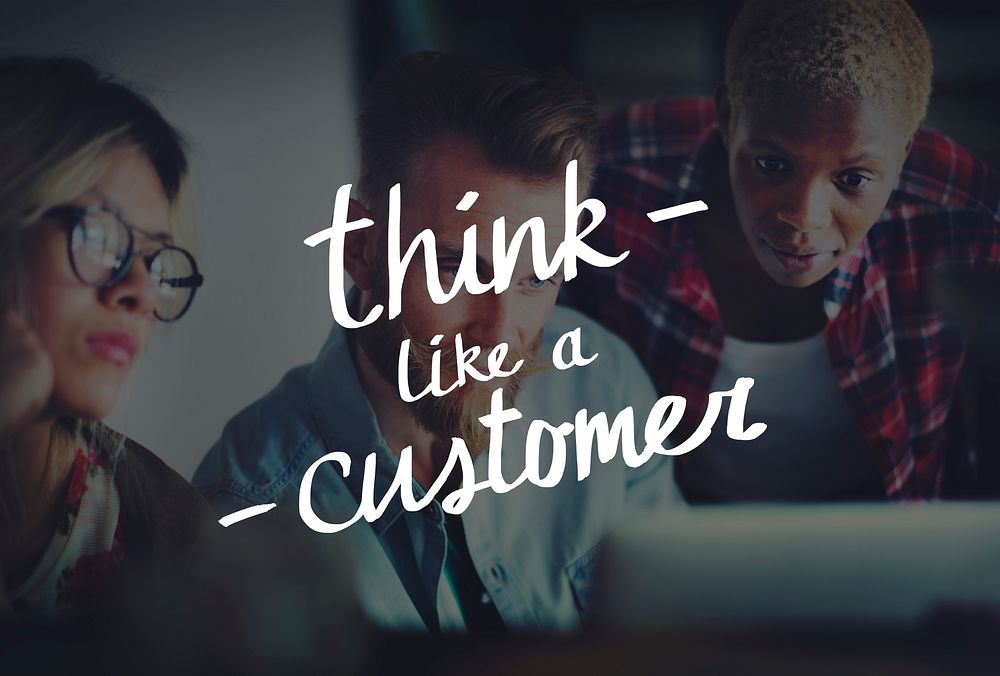 Think like a customer words on group of diverse people working background