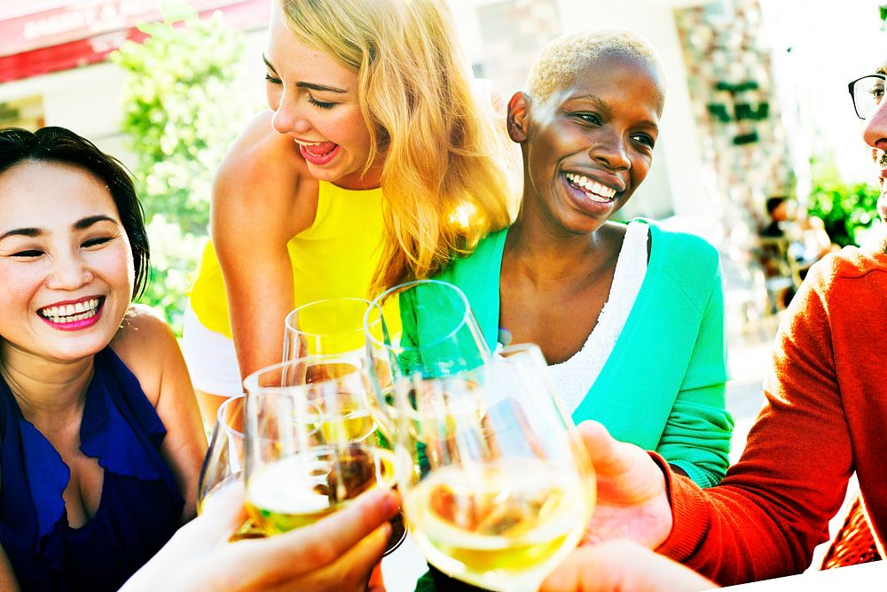 Group of friends drinking white wine
