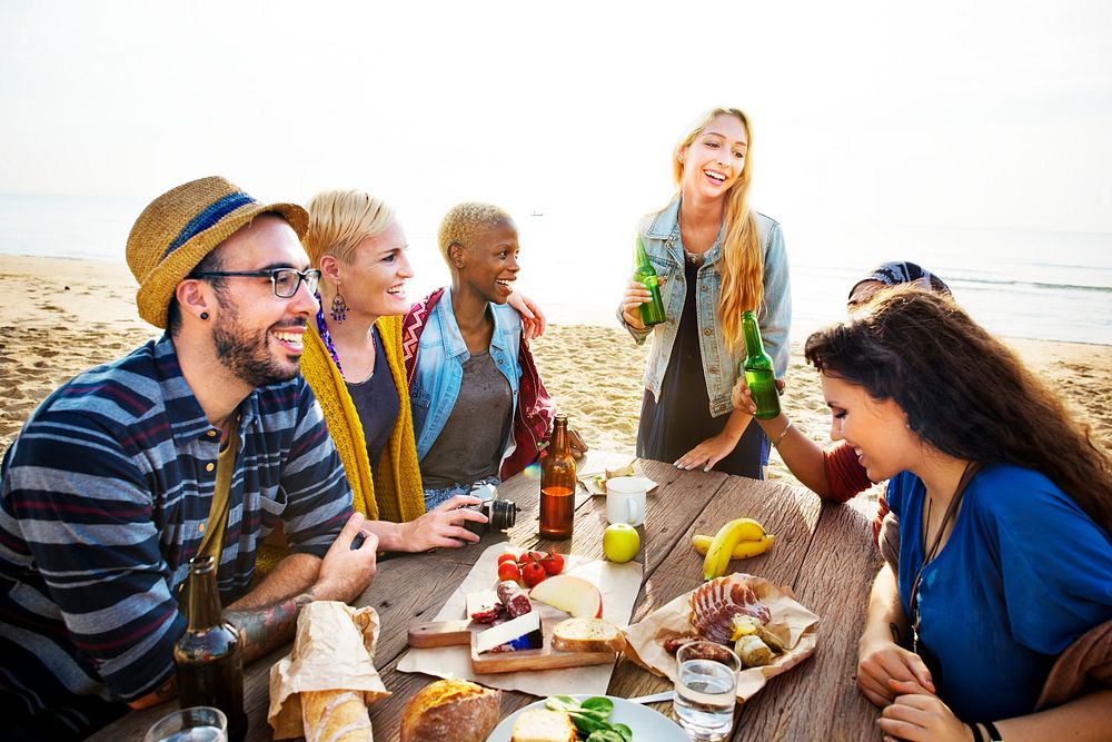 Friends having a picnic at the beach