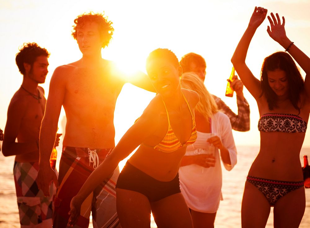 Young people enjoying a summer beach party