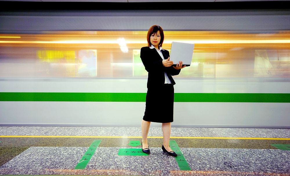 Asian businesswoman at underground station.