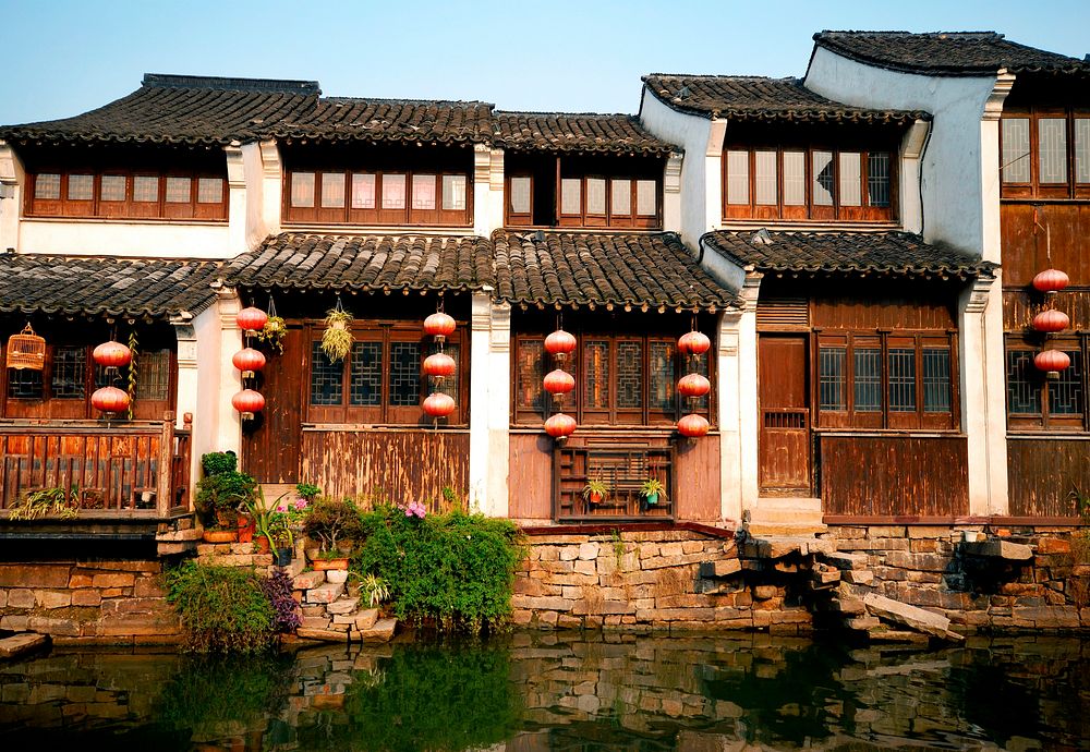 Traditional Chinese houses lining a canal in Suzhou, China.