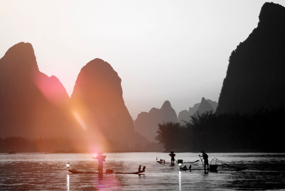 Silhouette of Fishermen in China Landscape Concept