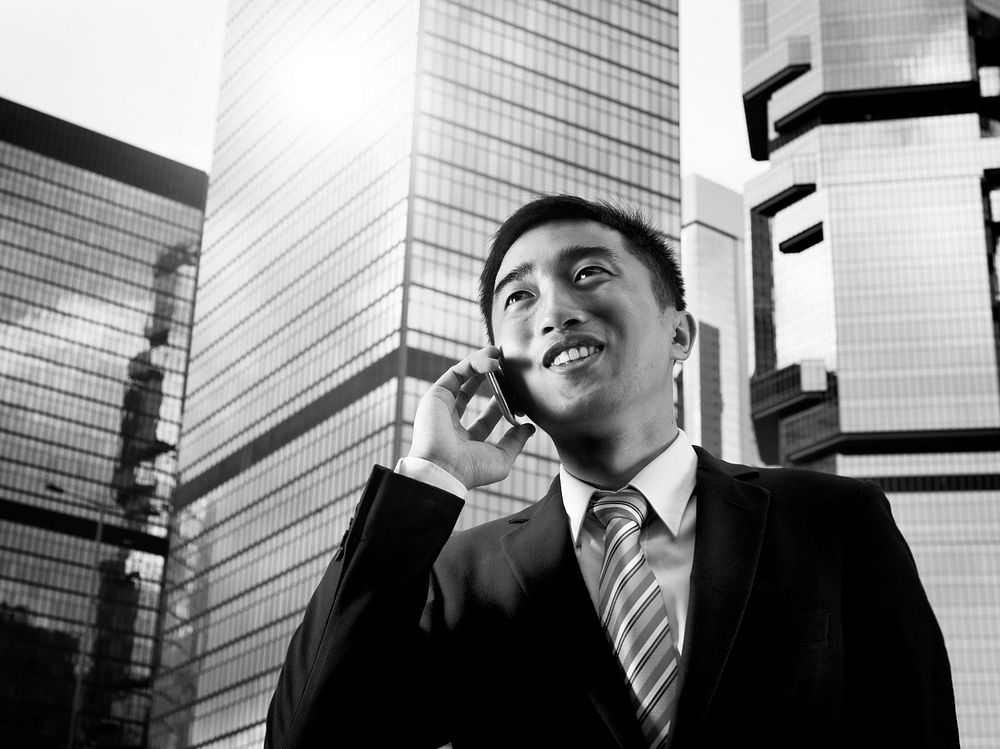 Businessman China Hong Kong Talking Phone Concept