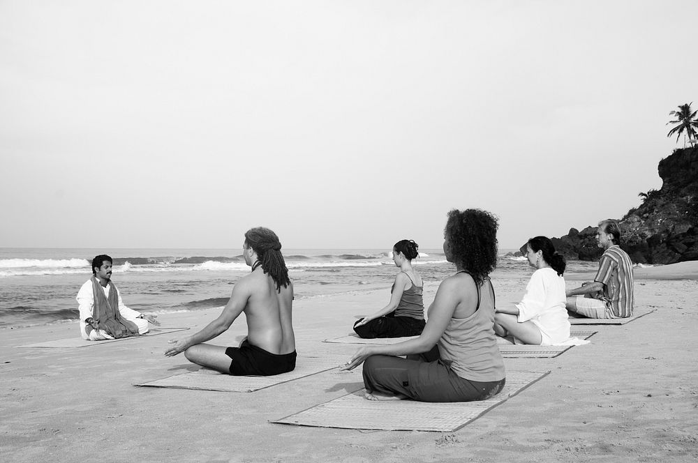 Yoga class by the beach
