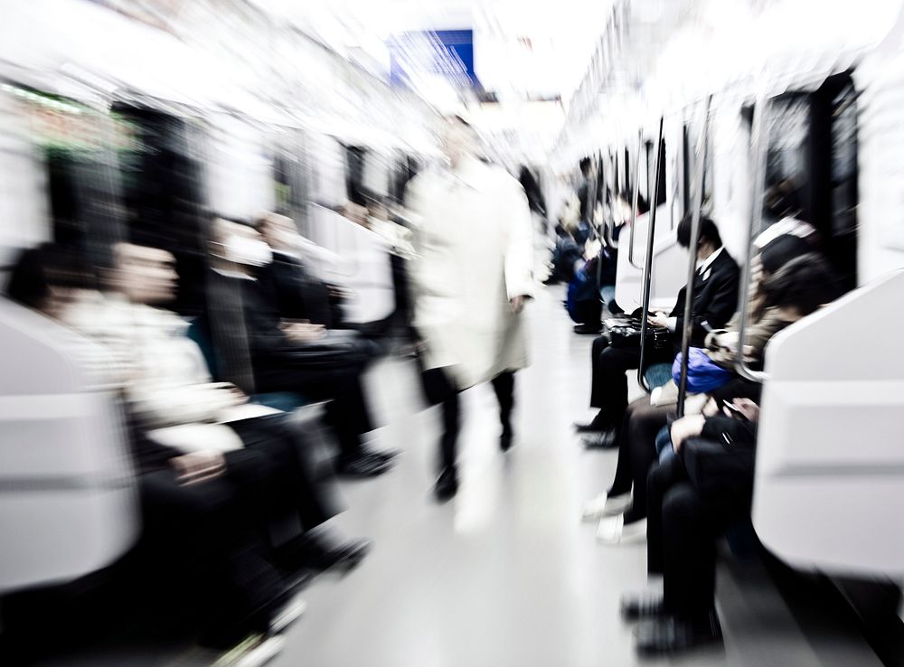 Abstract image of Japanese commuters in Tokyo. Blurred motion with lense zooming for impact.