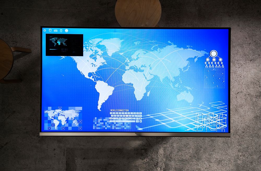 Cyber space table with a world map on screen