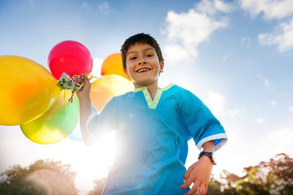 Boy with colorful balloons