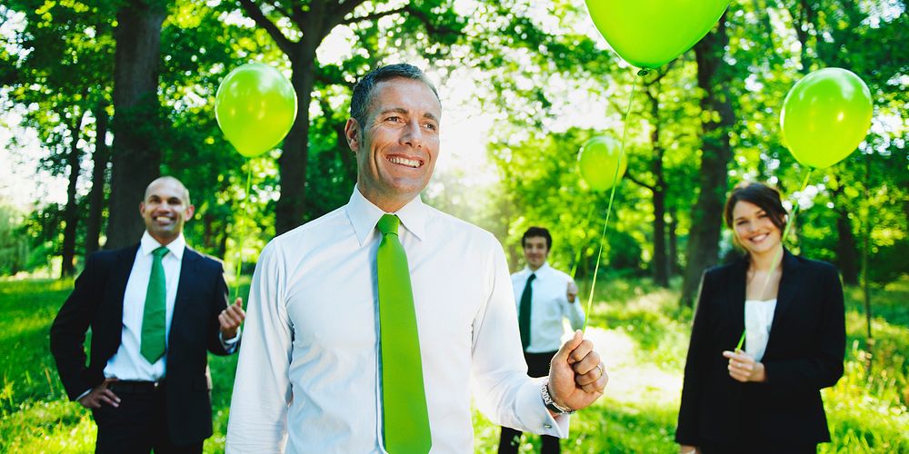 Eco-Friendly Business People Holding Green Balloons Concept