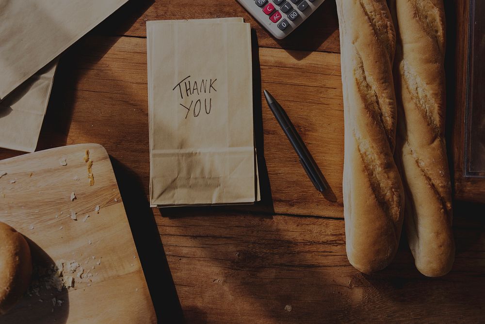 Aerial view of paper bag with bakery