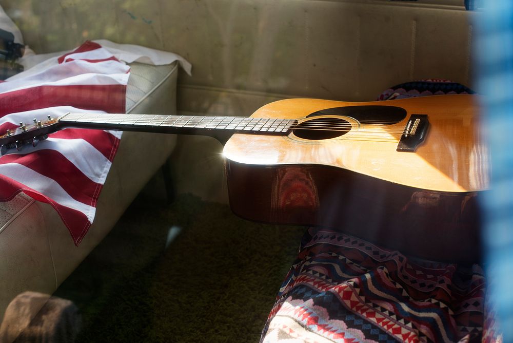 Guitar and American Flag on Van Rear Seat Road Trip Travel Journey